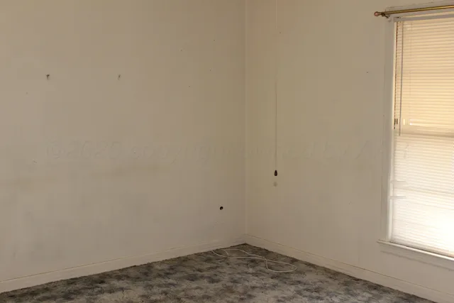 an empty room with a window