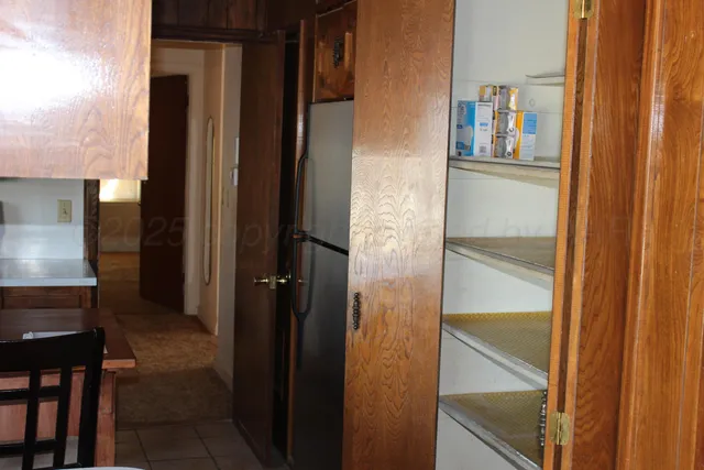 a kitchen with a stove and a refrigerator