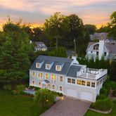 a aerial view of a house with swimming pool and garden