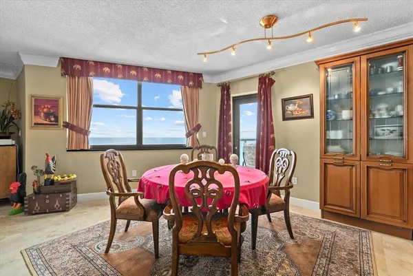 a view of a dining room with furniture window and outside view