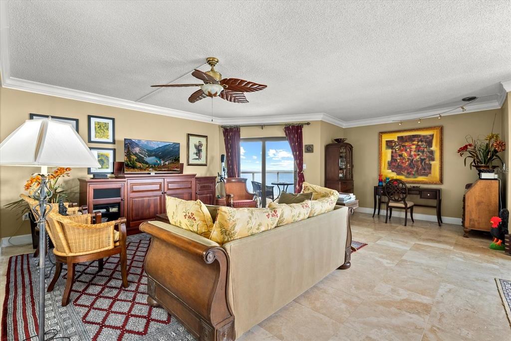 1000 Longboat Club Road, Unit 1001 Longboat Key, FL 34228 - Photo 15 of 40 a living room with furniture and a flat screen tv
