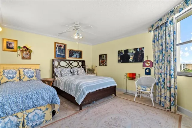 a bedroom with two beds and painting on the wall