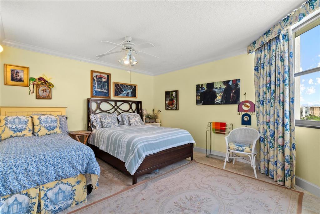 1000 Longboat Club Road, Unit 1001 Longboat Key, FL 34228 - Photo 19 of 40 a bedroom with two beds and painting on the wall