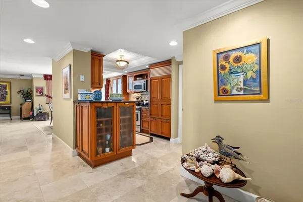 a living room with stainless steel appliances kitchen island granite countertop furniture and a view of kitchen