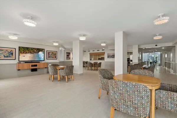 a view of a livingroom with furniture and a kitchen