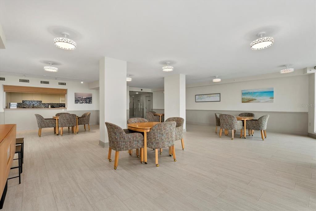 1000 Longboat Club Road, Unit 1001 Longboat Key, FL 34228 - Photo 28 of 40 a view of a a dining room with furniture window and outside view