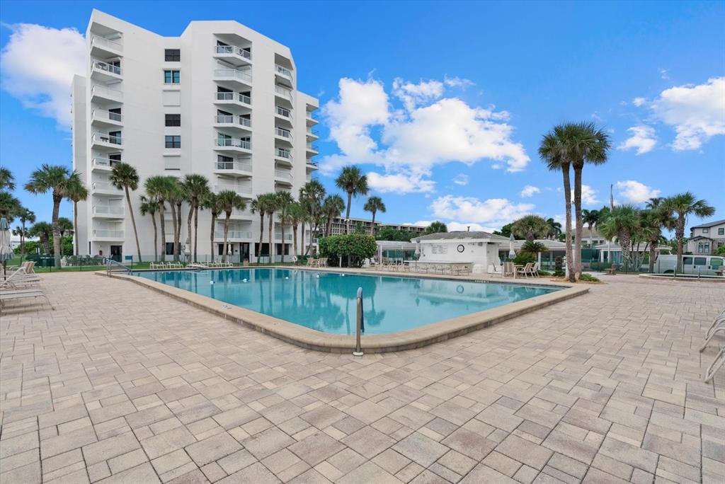 1000 Longboat Club Road, Unit 1001 Longboat Key, FL 34228 - Photo 31 of 40 a view of a multi story residential apartment building with a yard