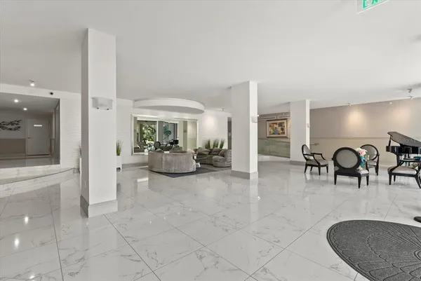 a living room with furniture and a table