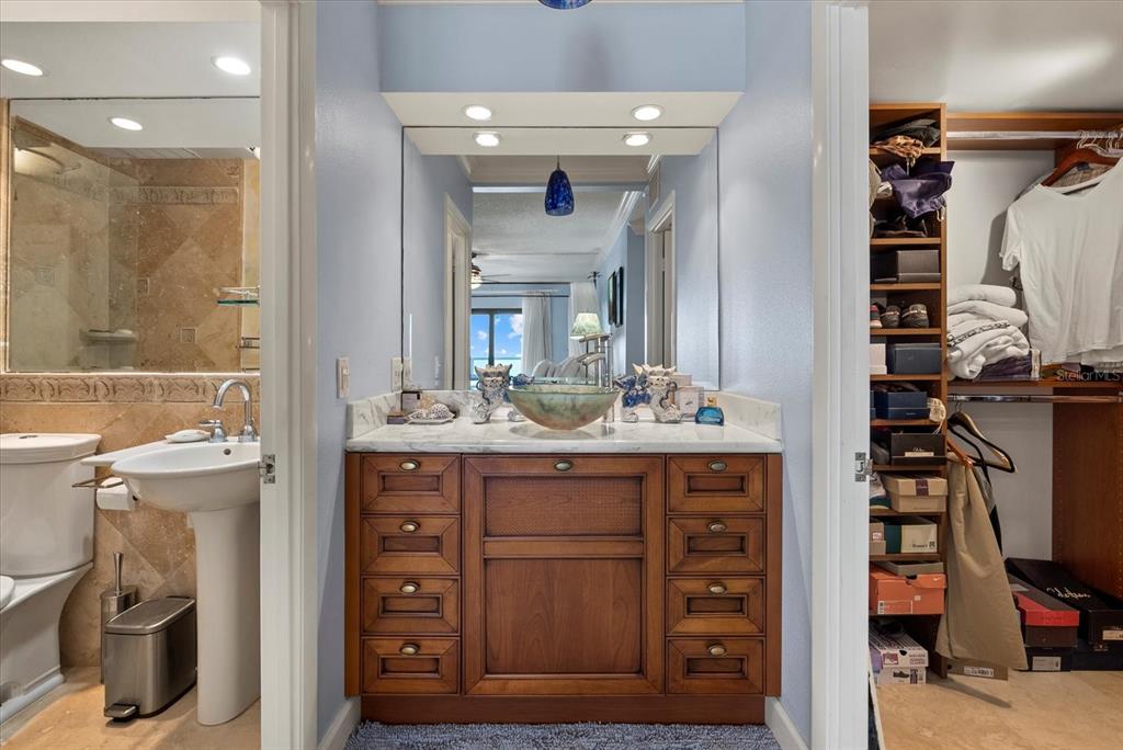 1000 Longboat Club Road, Unit 1001 Longboat Key, FL 34228 - Photo 8 of 40 a bathroom with a sink a vanity and a mirror