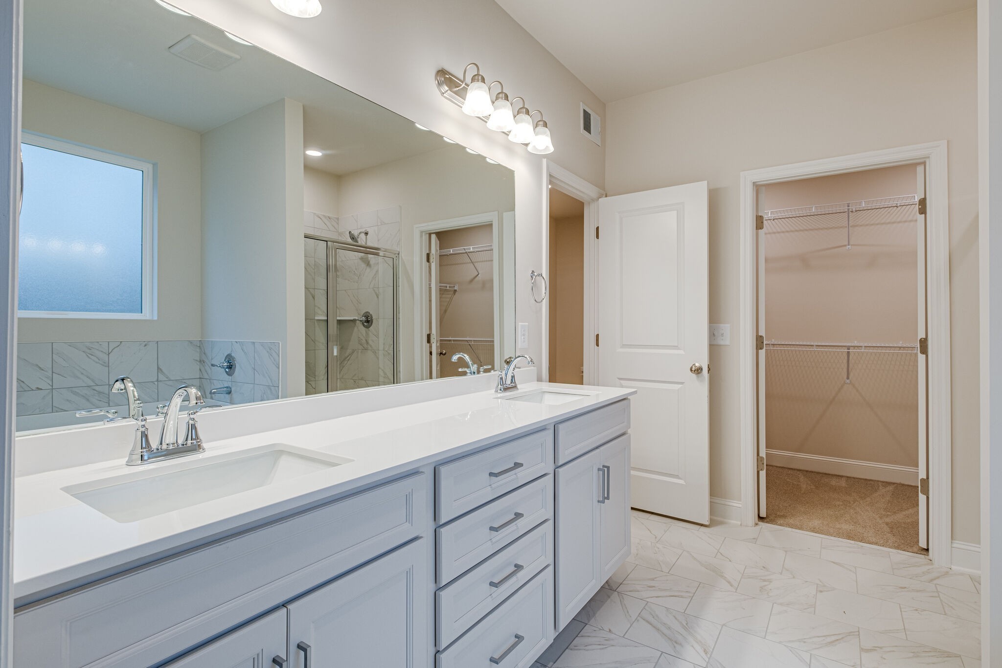 3017 Fanshaw Road Smyrna, TN 37167 - Photo 15 of 39 a spacious bathroom with a shower sink and a mirror