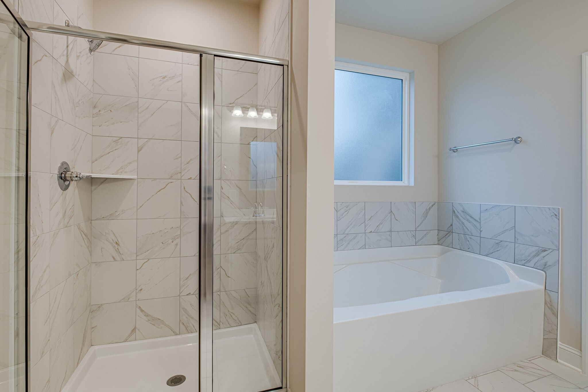 3017 Fanshaw Road Smyrna, TN 37167 - Photo 16 of 39 a bathroom with a bathtub and shower