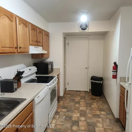 a kitchen that has a sink and a stove