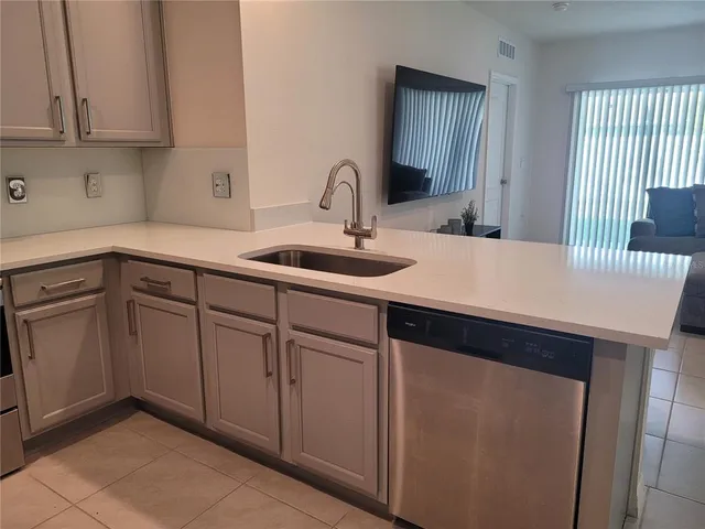 a kitchen with a sink and cabinets