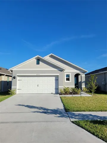 a view of house with yard