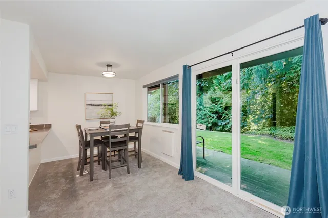 a living room with furniture potted plant and a window