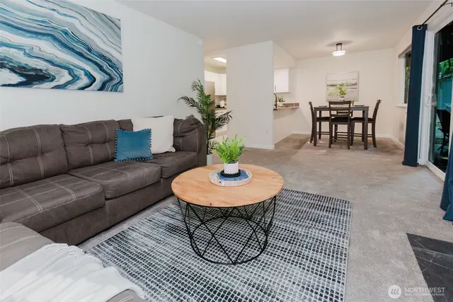a bedroom with a bed and a potted plant