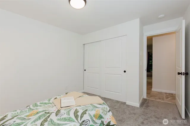 a view of a chairs and table in the back yard of the house