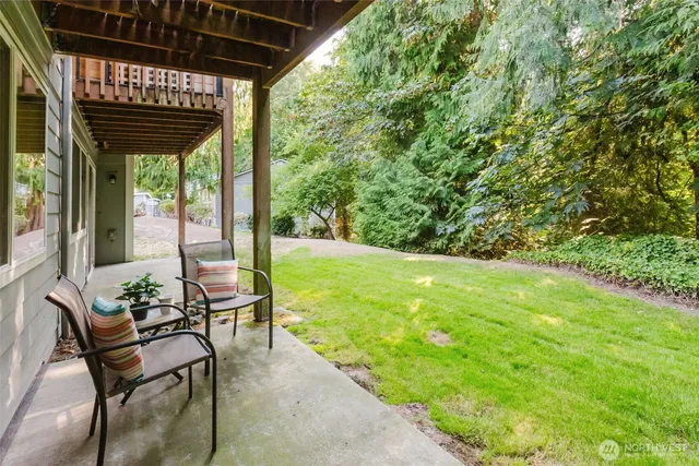 a front view of a house with a yard and fountain