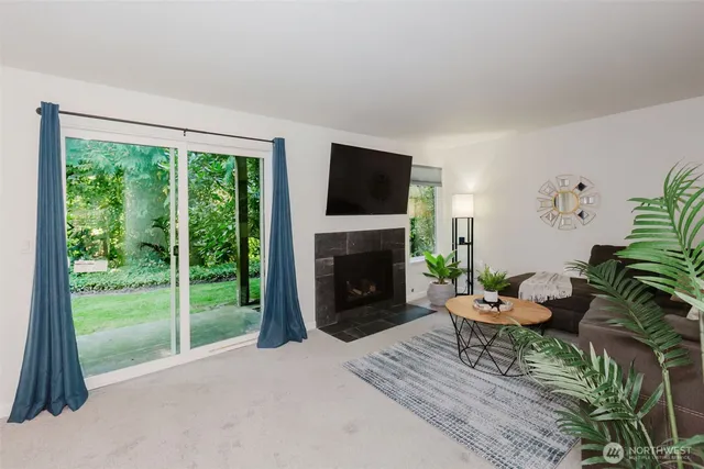 a kitchen with stainless steel appliances granite countertop a sink a stove and a granite counter tops with wooden floors