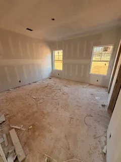 a view of an empty room and a window