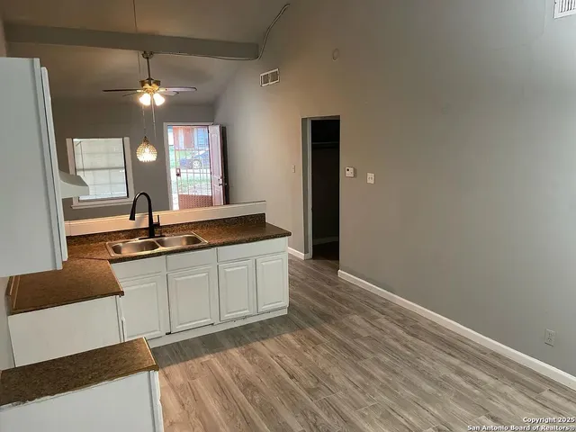 a view of a bathroom with sink and mirror