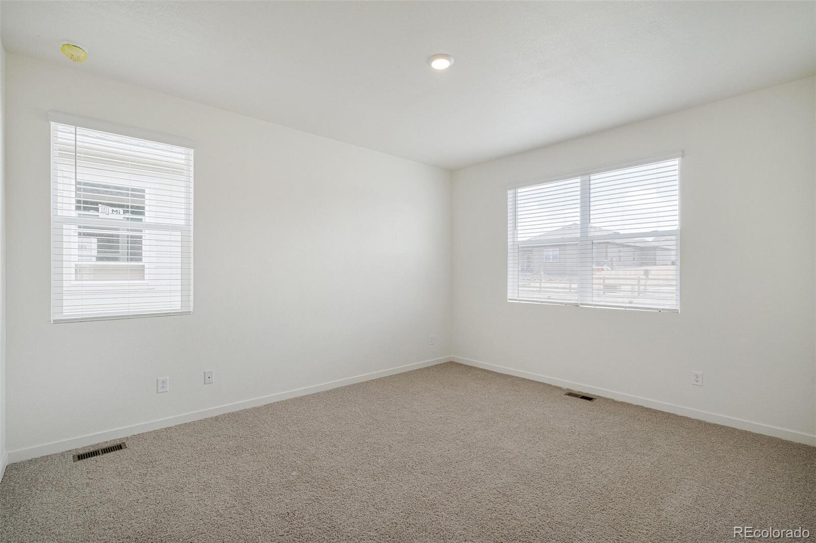 522 Twilight Court Fort Lupton, CO 80621 - Photo 18 of 29 an empty room with a window