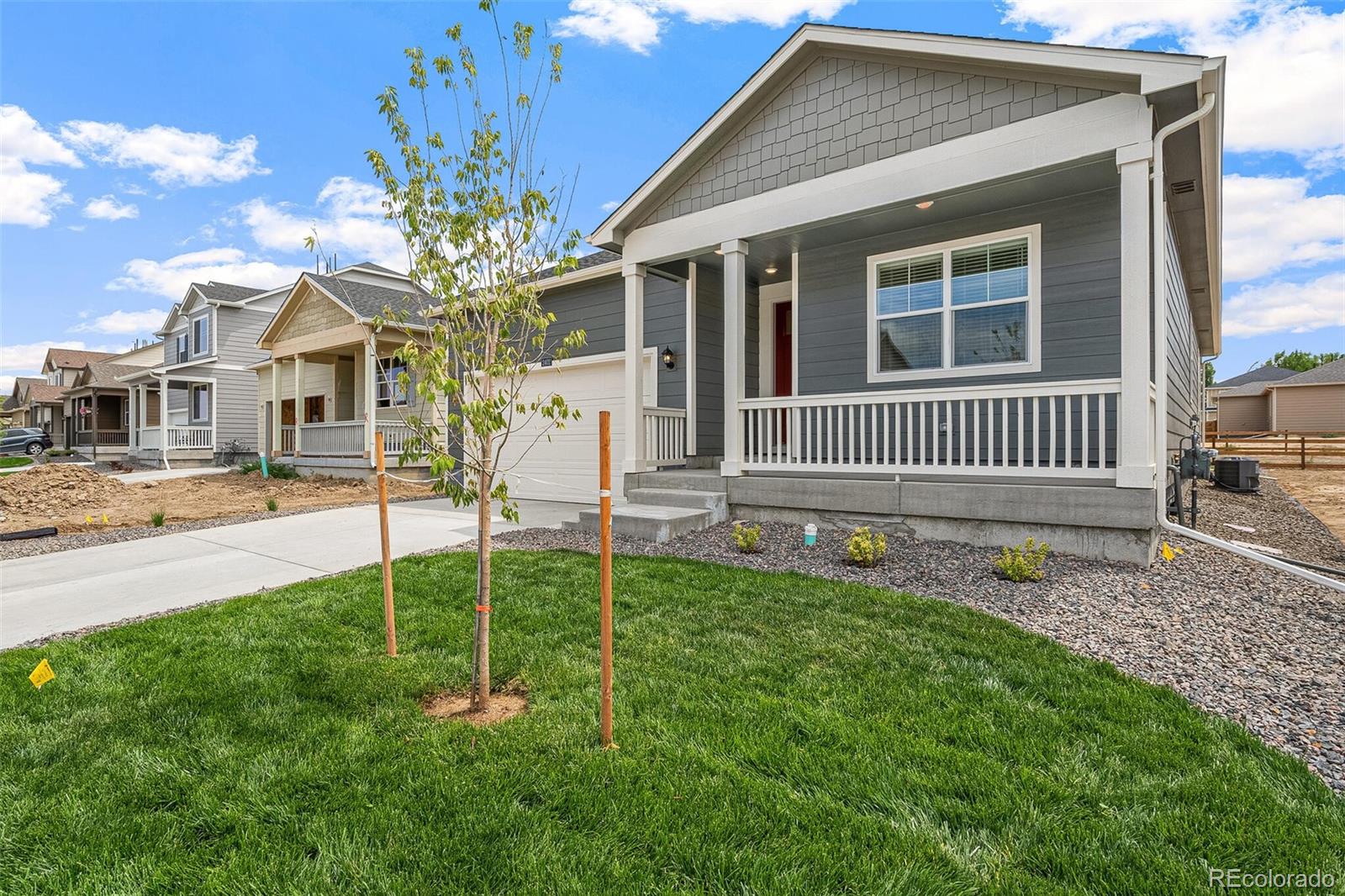 522 Twilight Court Fort Lupton, CO 80621 - Photo 3 of 29 a front view of a house with garden
