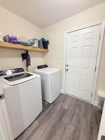 a view of storage and utility room with washer and dryer