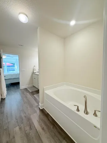 a bathroom with a bathtub and a toilet