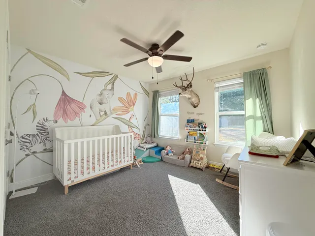 a bedroom with furniture and window