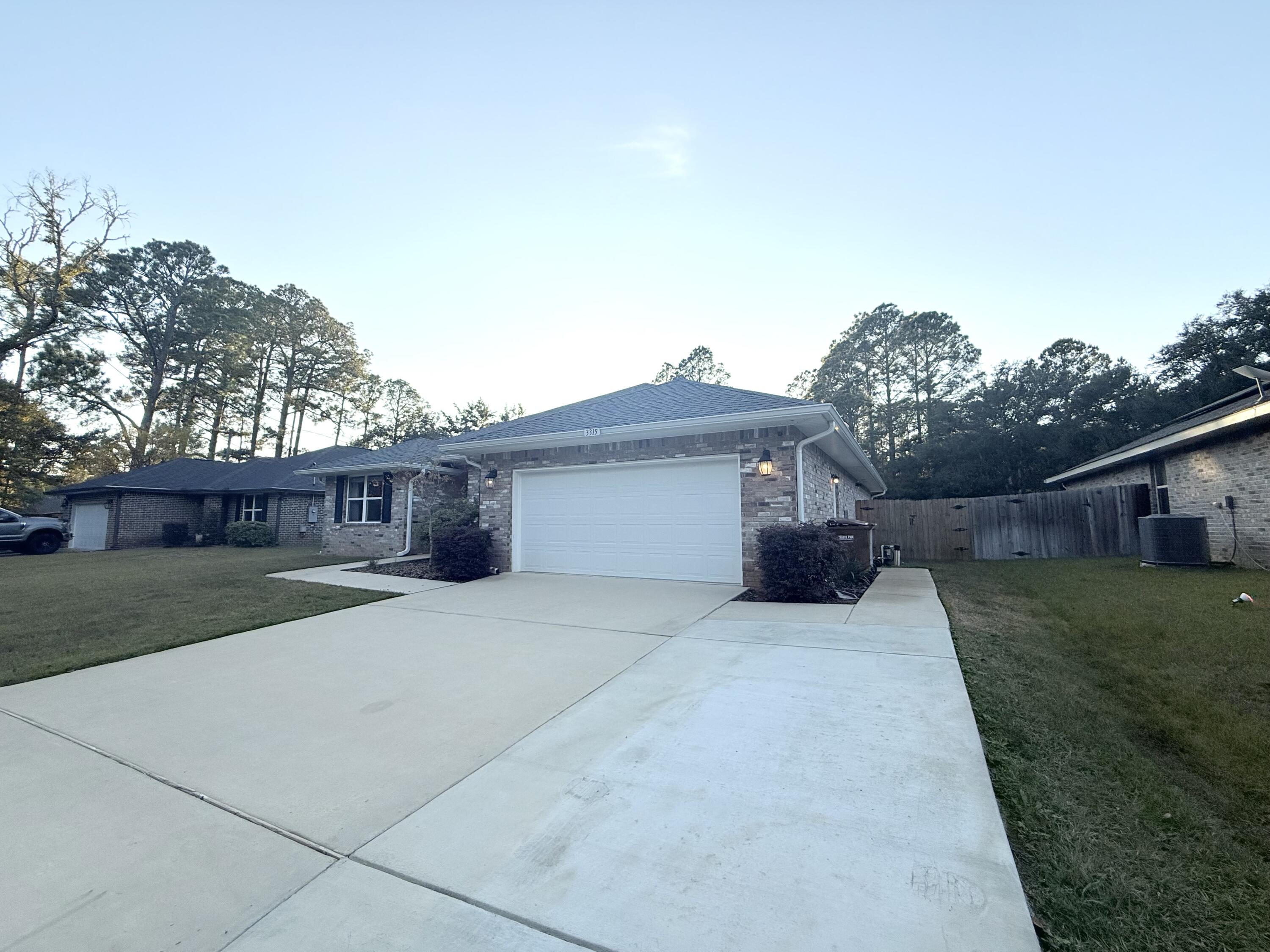 3315 Doyle Hawkins Road Navarre, FL 32566 - Photo 2 of 36 a house view with a garden space