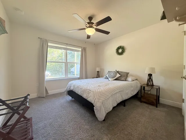 a bedroom with a bed and window