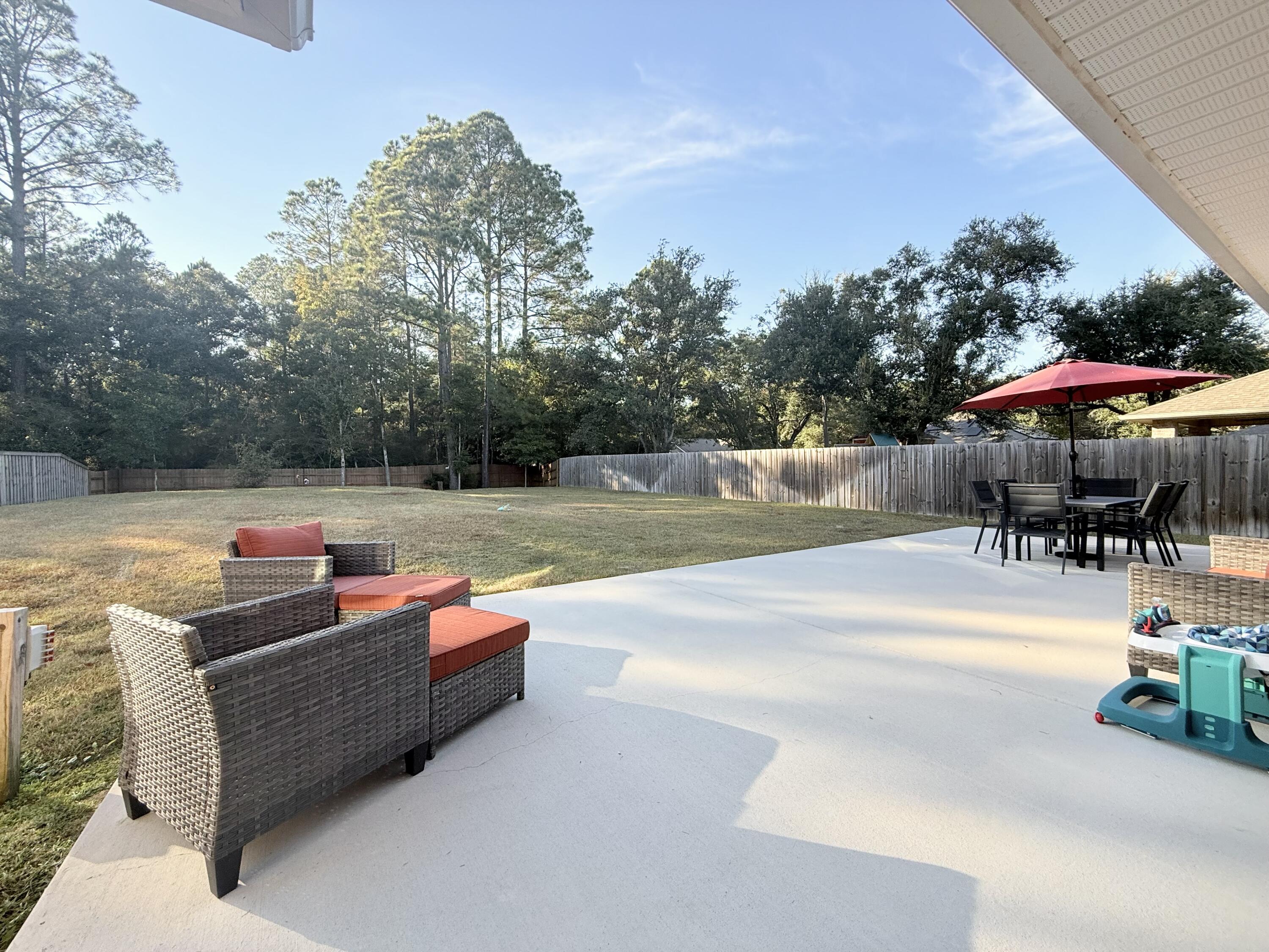 3315 Doyle Hawkins Road Navarre, FL 32566 - Photo 34 of 36 swimming pool view with a seating space