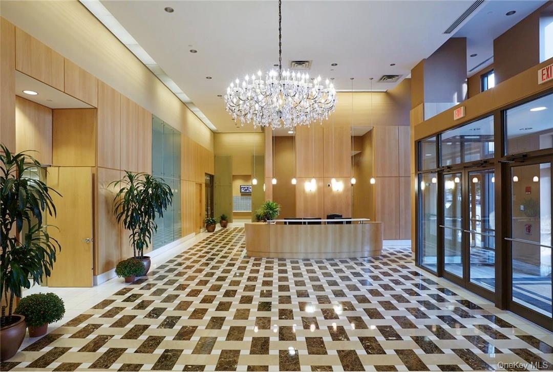 175 Huguenot Street, Unit 1405 New Rochelle, NY 10801 - Photo 2 of 20 a view of entryway with a rug