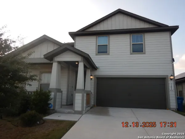 a front view of a house with garage