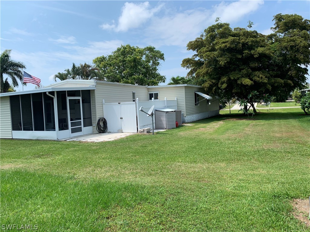 7775 Farrell Road Bokeelia, FL 33922 - Photo 8 of 33 a view of a backyard with a garden and plants