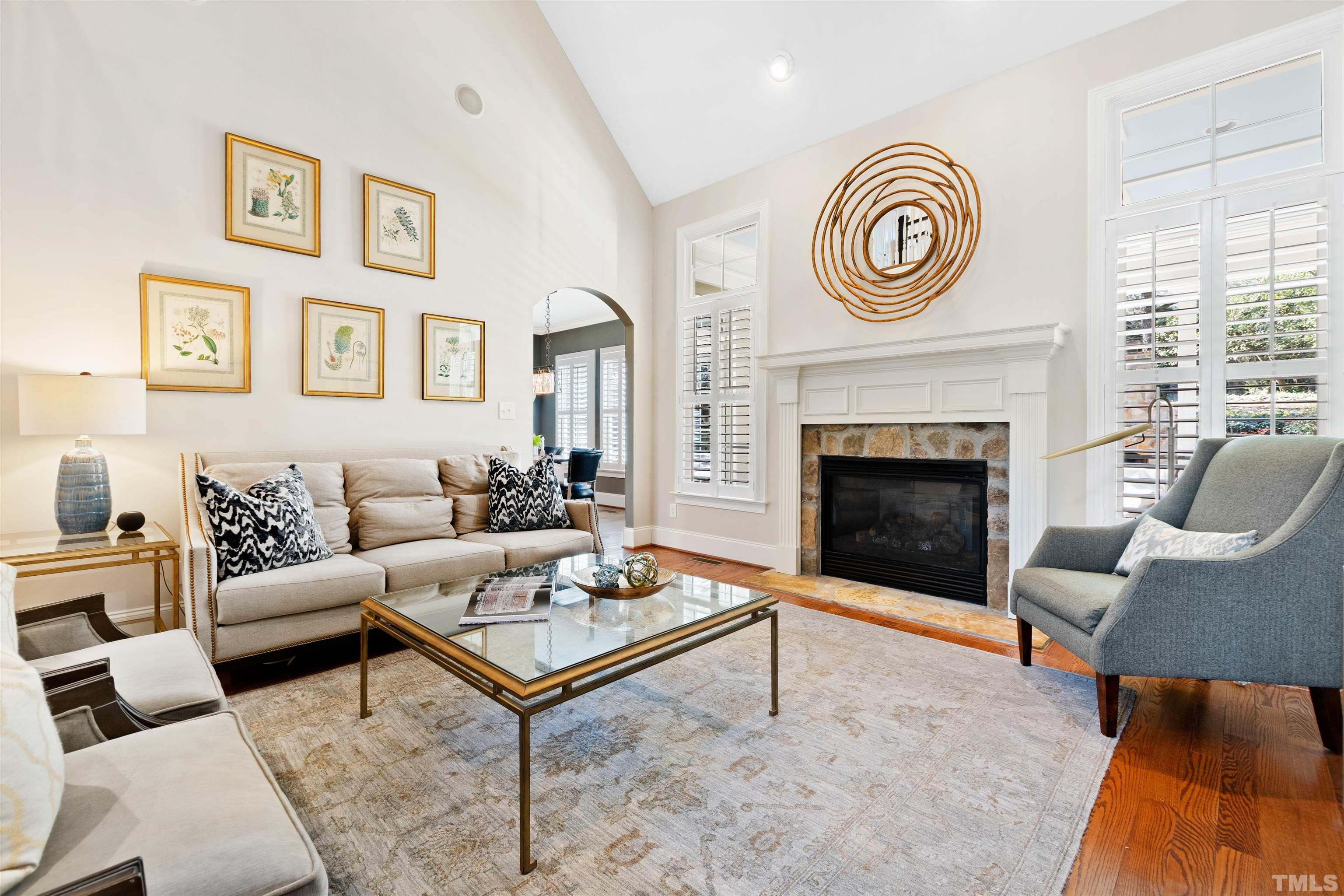 761 Wimbleton Drive Raleigh, NC 27609 - Photo 16 of 70 a living room with furniture and a fireplace