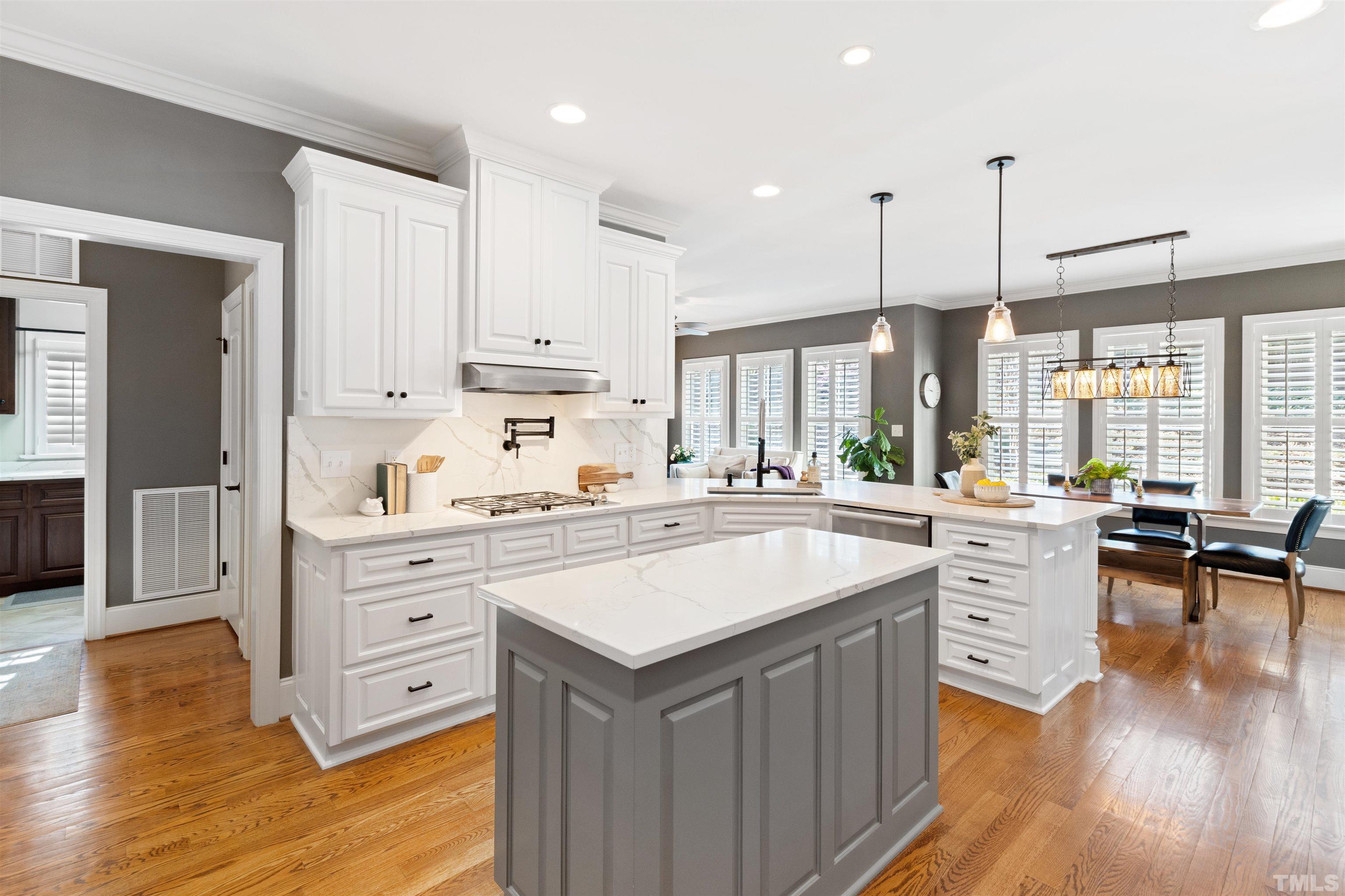 761 Wimbleton Drive Raleigh, NC 27609 - Photo 29 of 70 a kitchen with white cabinets and white appliances