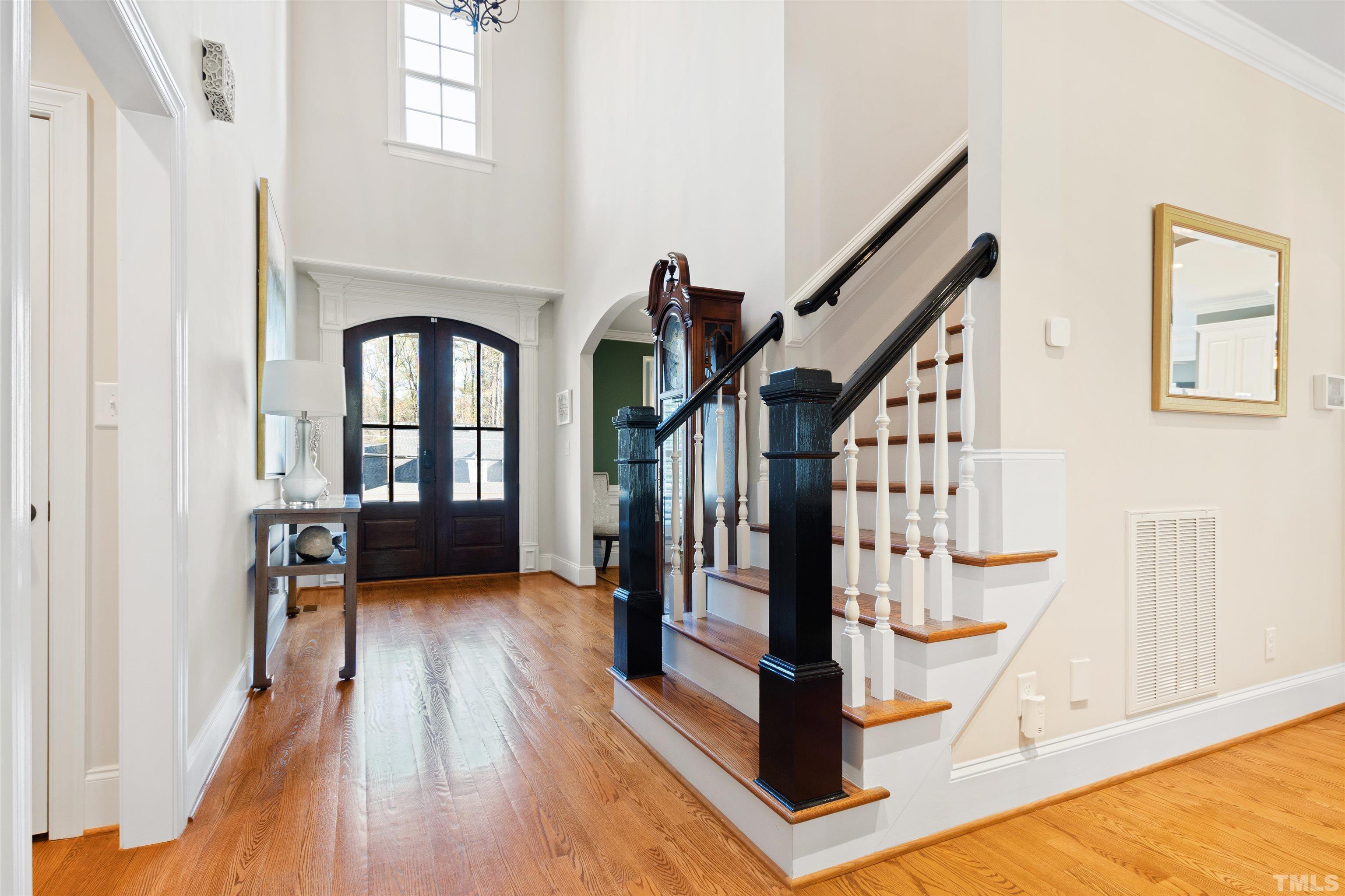 761 Wimbleton Drive Raleigh, NC 27609 - Photo 44 of 70 a view of an entryway wooden floor and staircase
