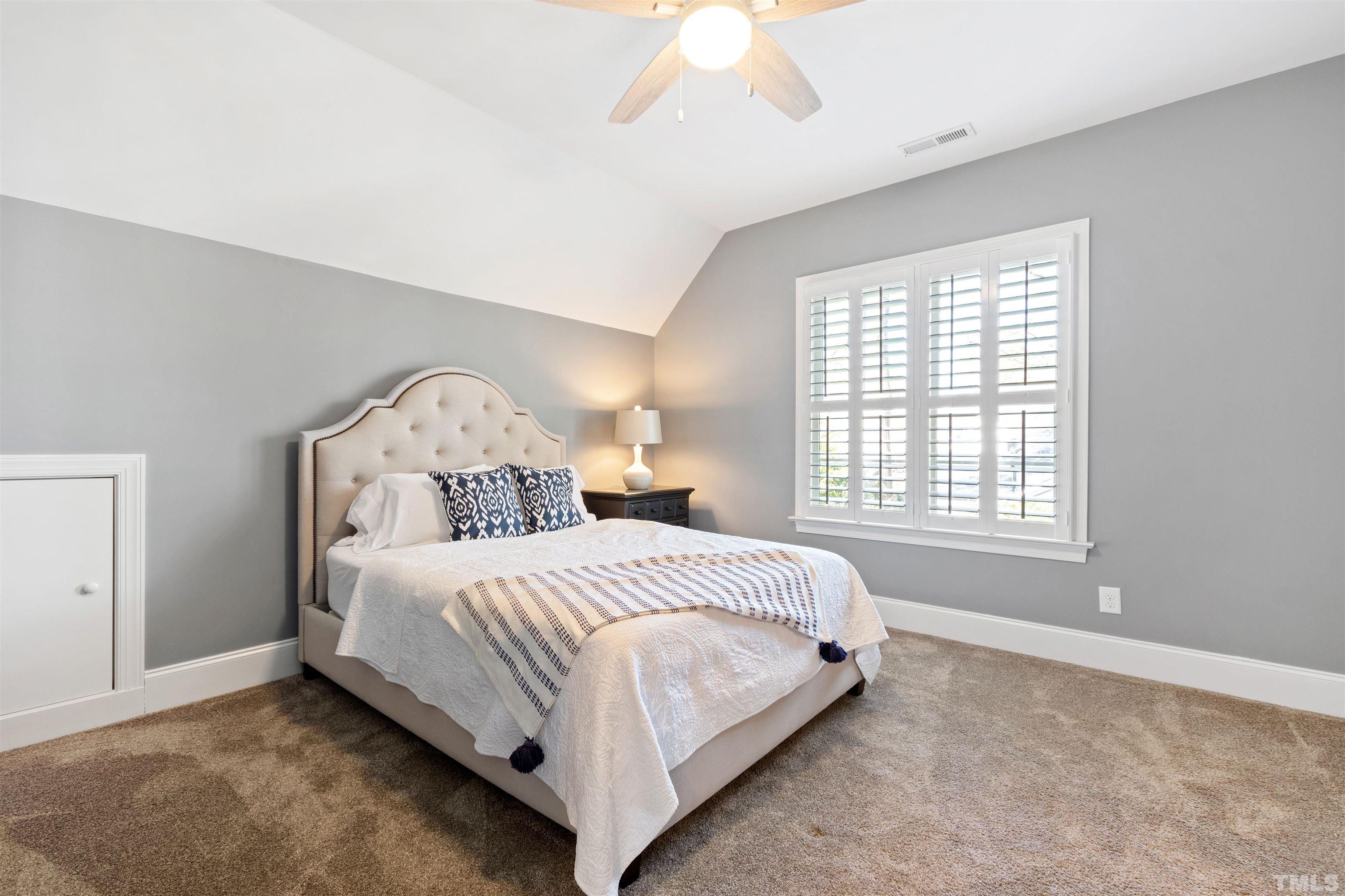 761 Wimbleton Drive Raleigh, NC 27609 - Photo 51 of 70 a bedroom with a bed and a window
