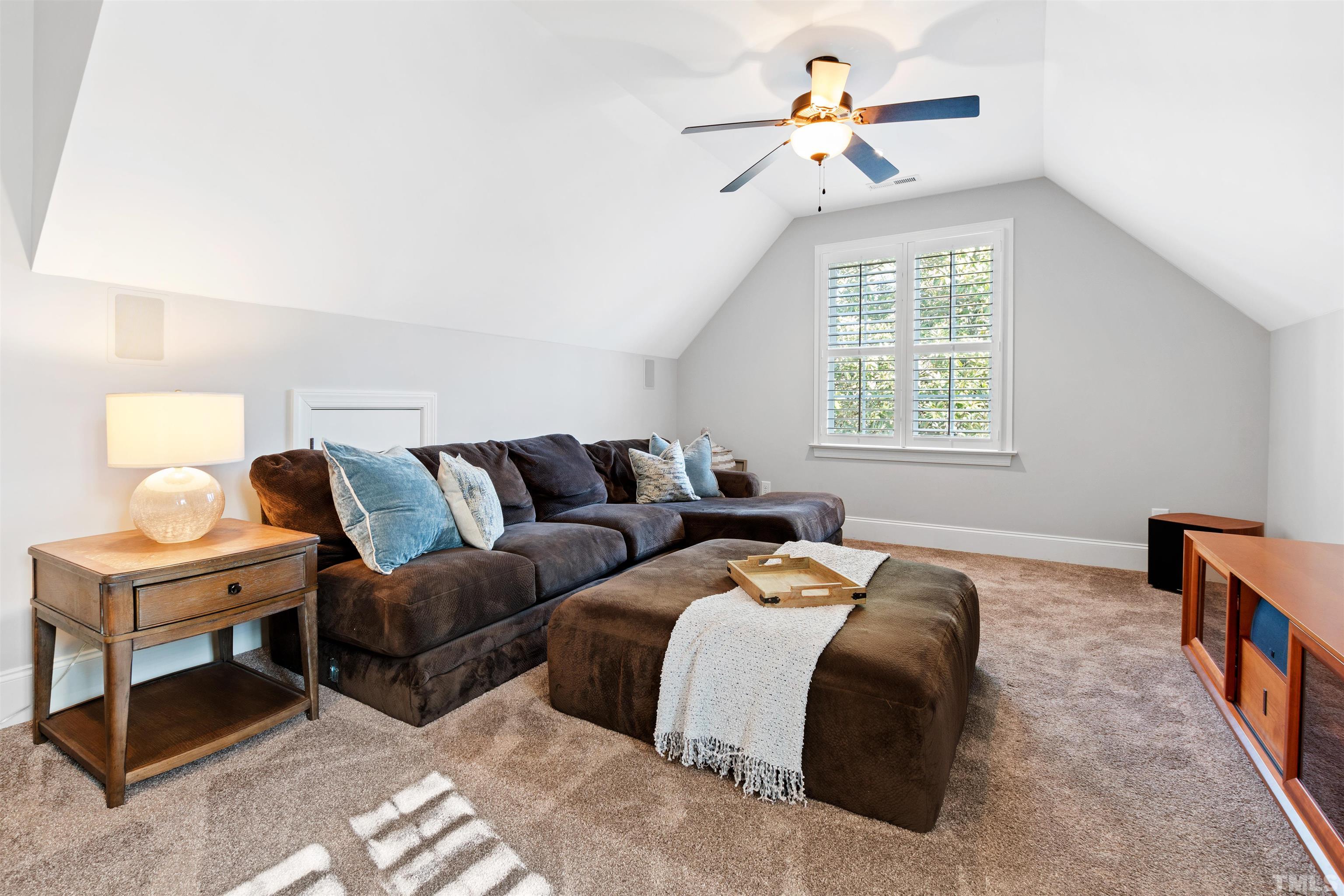 761 Wimbleton Drive Raleigh, NC 27609 - Photo 53 of 70 a living room with furniture ceiling fan and a window