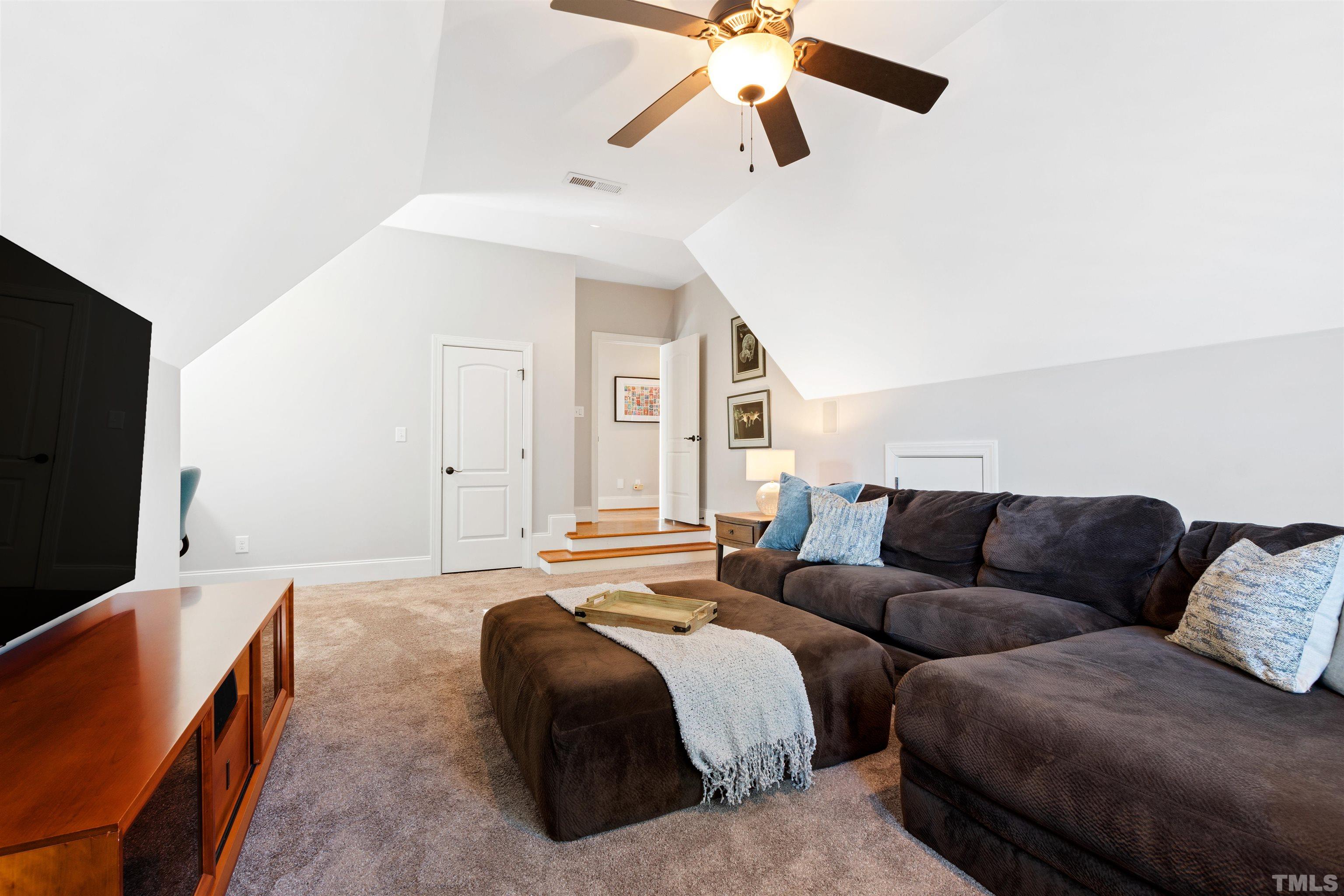 761 Wimbleton Drive Raleigh, NC 27609 - Photo 54 of 70 a bedroom with furniture and a flat screen tv