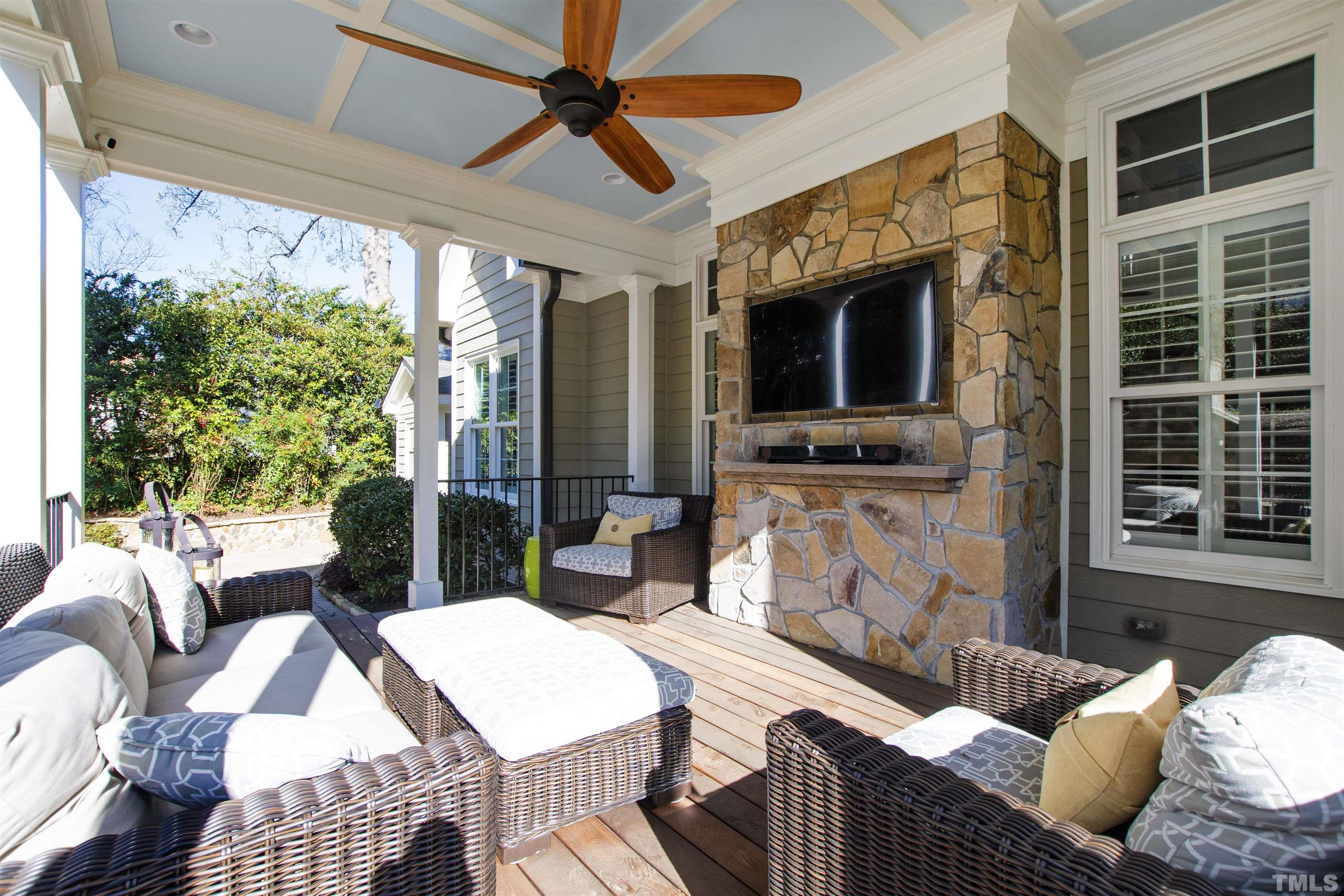 761 Wimbleton Drive Raleigh, NC 27609 - Photo 7 of 70 a living room with furniture fireplace and a flat screen tv