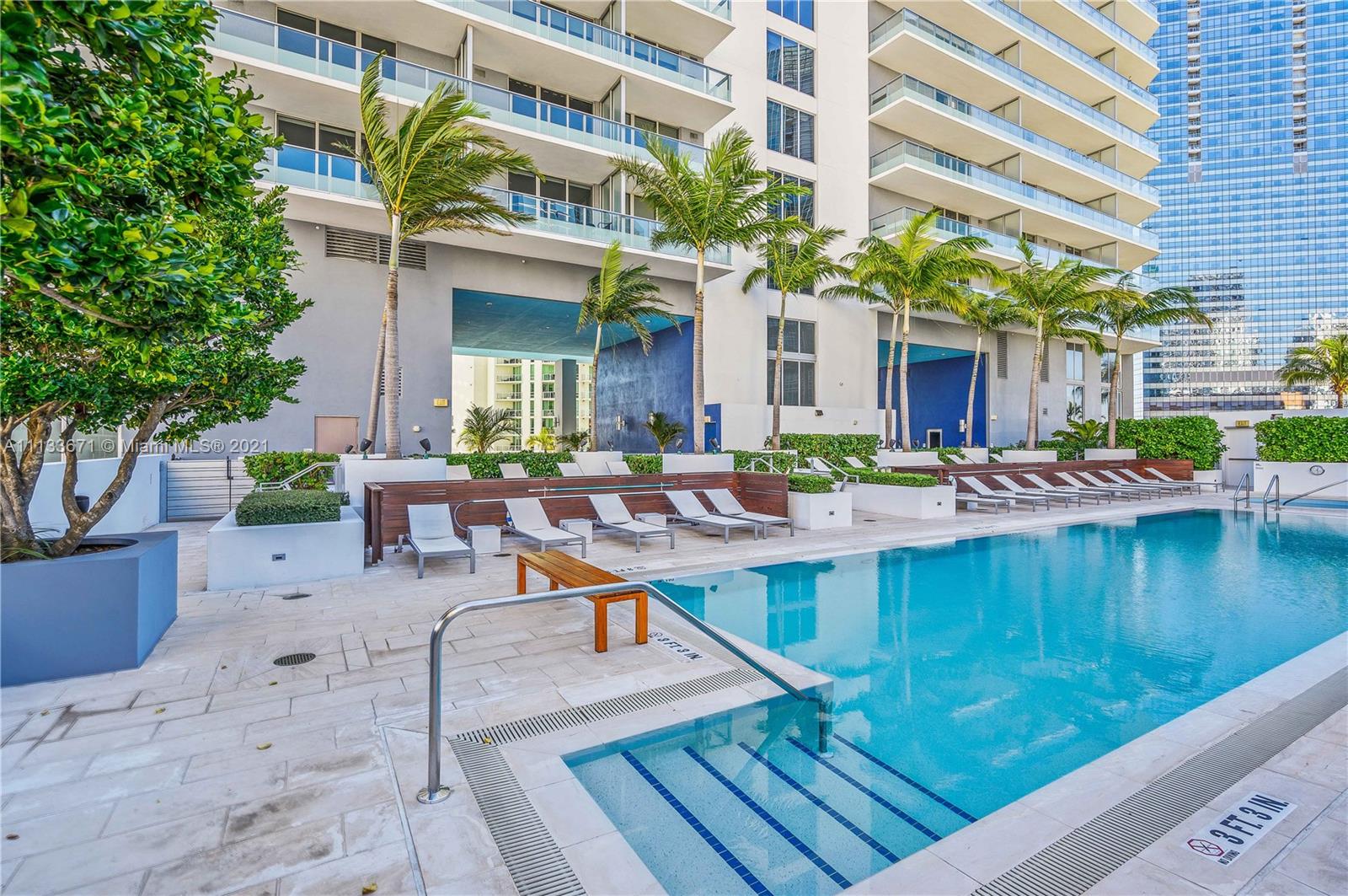 1300 Brickell Bay Drive, Unit 1603 Miami, FL 33131 - Photo 30 of 32 a view of a swimming pool with outdoor seating