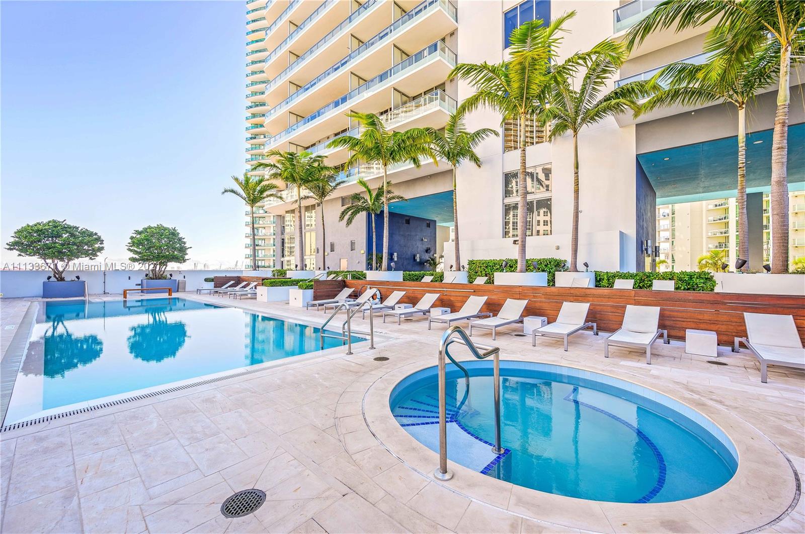 1300 Brickell Bay Drive, Unit 1603 Miami, FL 33131 - Photo 32 of 32 a view of a swimming pool with outdoor seating
