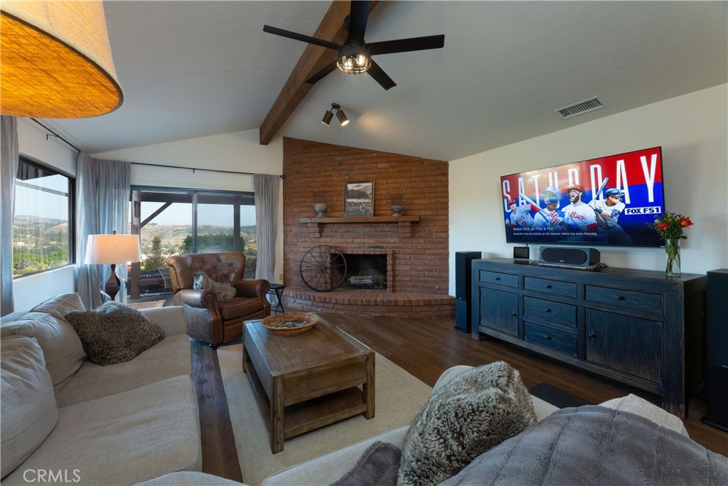 2509 Valerie Drive Fallbrook, CA 92028 - Photo 27 of 70 a living room with furniture fireplace and flat screen tv