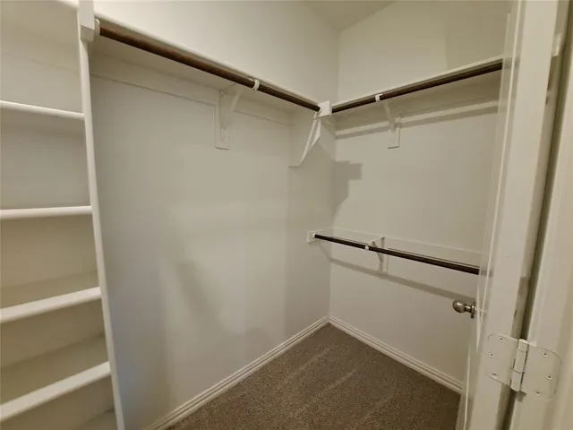 a view of an empty walk in closet
