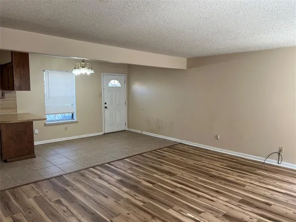 a view of a livingroom with wooden floor