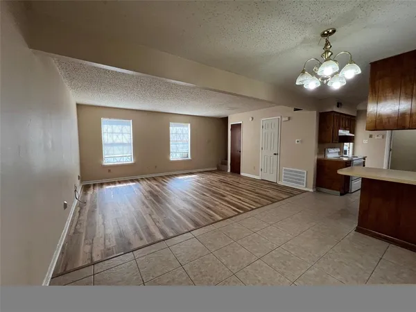 a view of livingroom with kitchen island furniture and flat screen tv