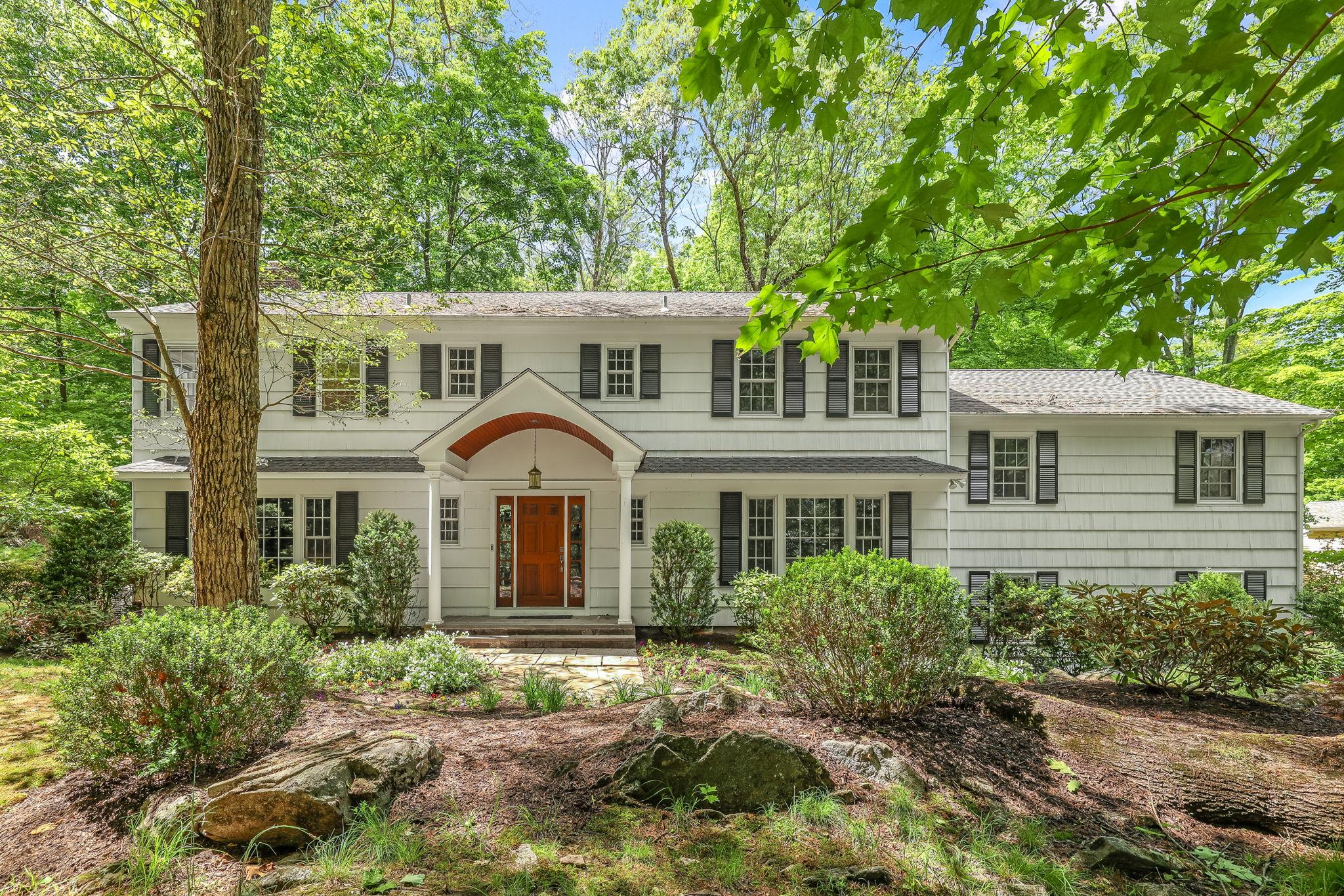 front view of a house with a yard